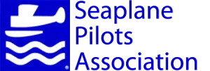 Logo of the Seaplane Pilots Association with a white seaplane and water waves icon on a blue background, and the group's name in blue text to the right—perfect for bed and breakfast owners on Torch Lake seeking aviation-friendly branding.